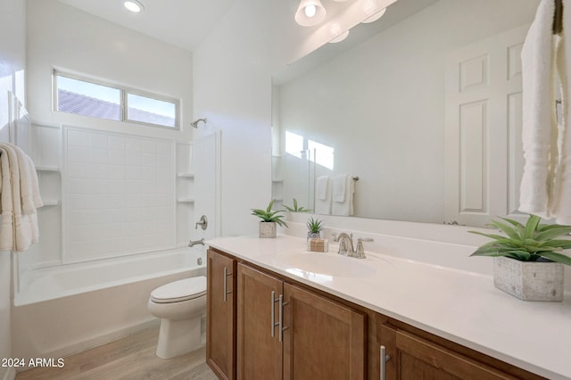 full bathroom featuring vanity, toilet, shower / tub combination, and hardwood / wood-style flooring