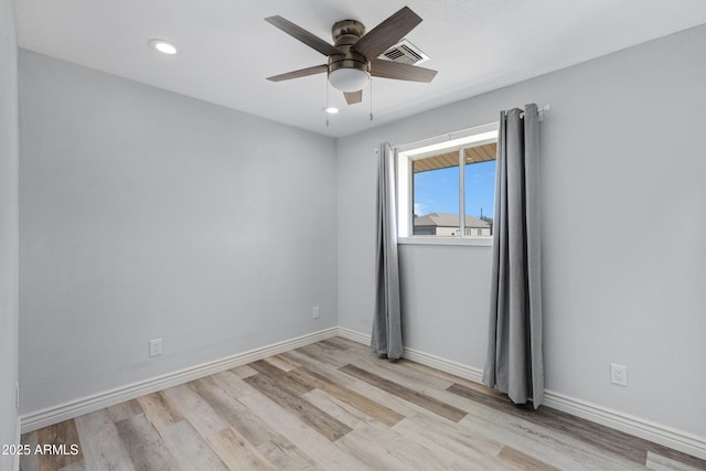 unfurnished room featuring ceiling fan and light wood-type flooring