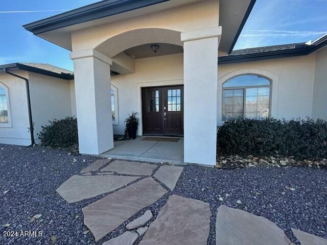 entrance to property featuring french doors