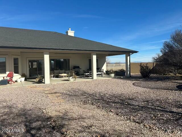 back of house featuring a patio area