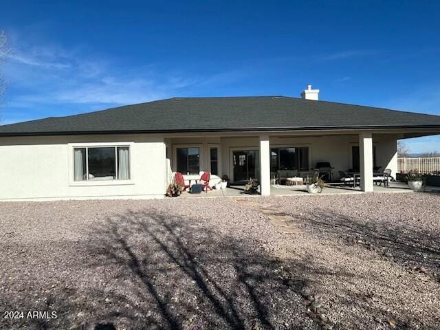 rear view of house with a patio area