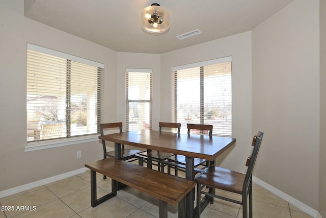 dining room with light tile patterned floors