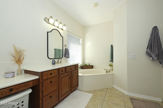 bathroom with vanity, tile patterned floors, and a tub