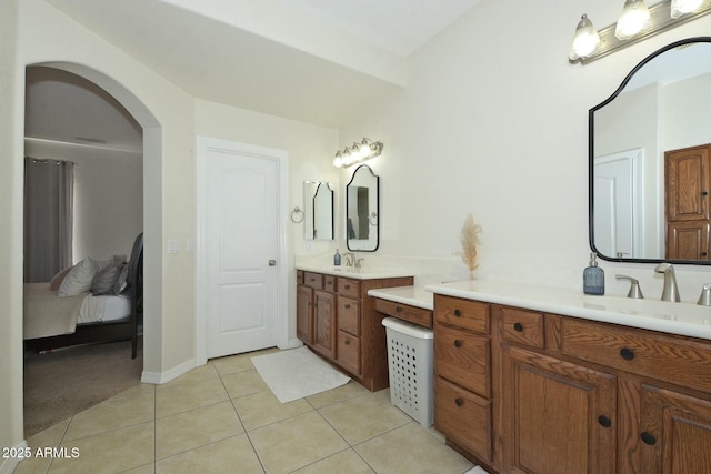 bathroom with tile patterned floors and vanity