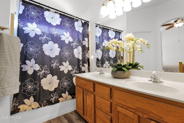 5424 S 15th St, Phoenix, AZ 85040 - full bathroom with double vanity, wood finished floors, shower / tub combo with curtain, and ceiling fan