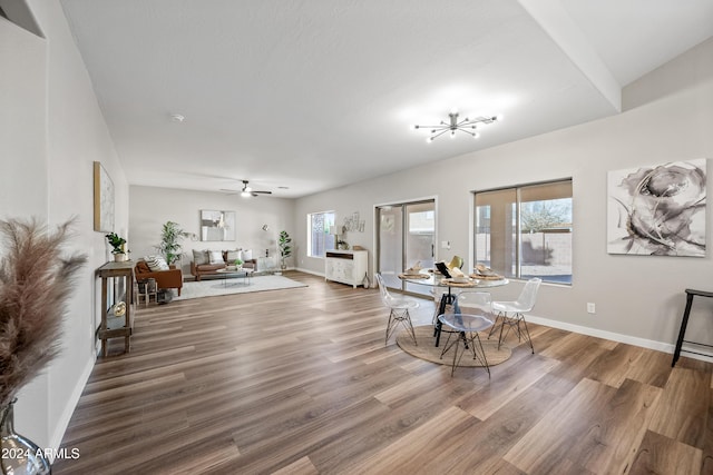 dining area with wood-type flooring and ceiling fan