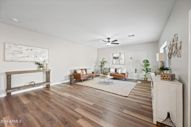 unfurnished living room with ceiling fan and dark hardwood / wood-style floors