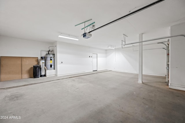 garage featuring a garage door opener and water heater