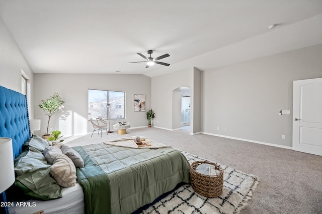 carpeted bedroom featuring ceiling fan and vaulted ceiling