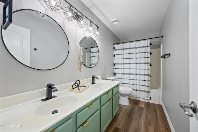 full bathroom featuring shower / bath combo, toilet, wood-type flooring, and vanity