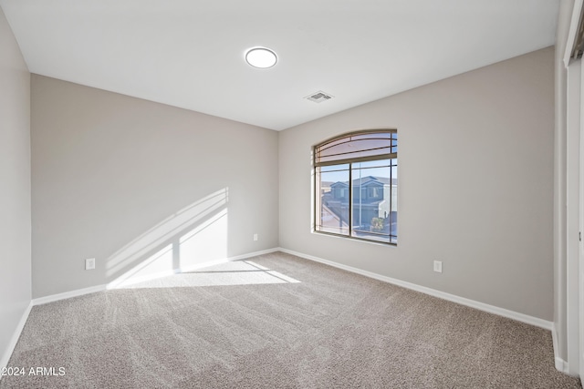 unfurnished room with carpet