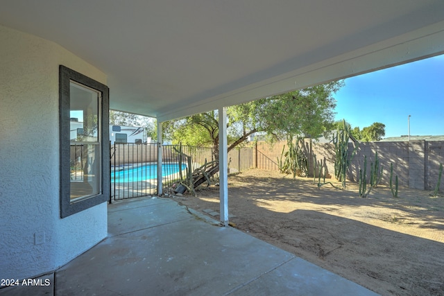 view of patio / terrace with a fenced in pool