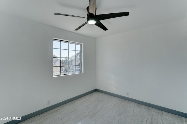 unfurnished room with ceiling fan