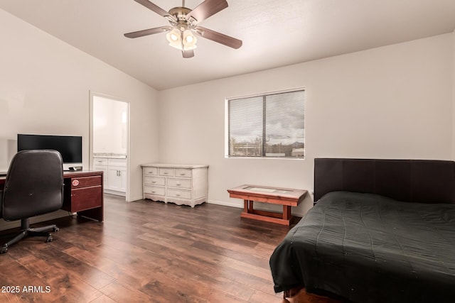 bedroom featuring dark wood finished floors, connected bathroom, a ceiling fan, and lofted ceiling