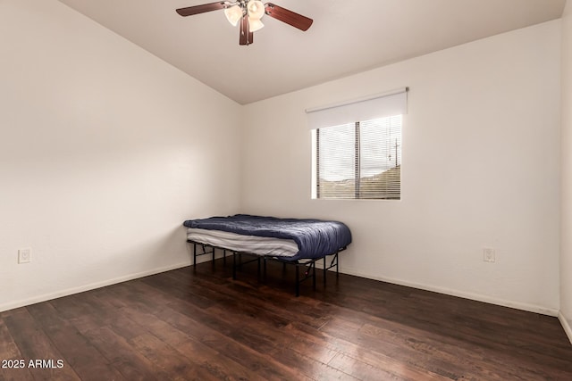 bedroom with baseboards, lofted ceiling, a ceiling fan, and hardwood / wood-style flooring