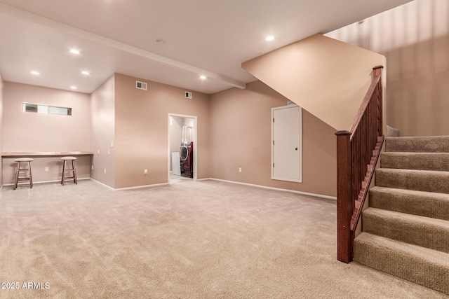 finished below grade area featuring stairway, recessed lighting, and carpet floors