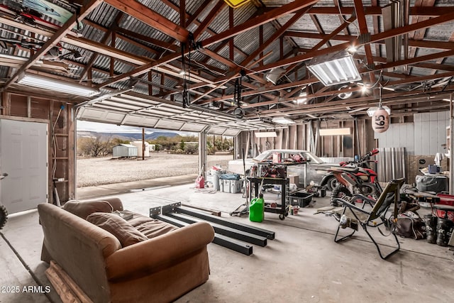 garage featuring a storage unit and a mountain view