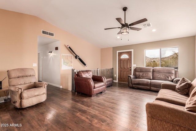 living room with visible vents, dark wood-style flooring, and vaulted ceiling