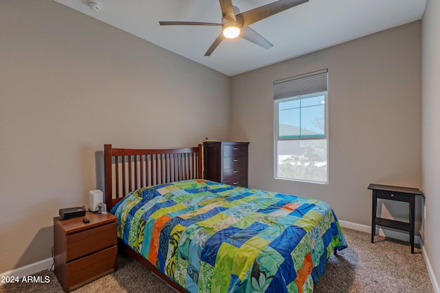 bedroom with light carpet and ceiling fan