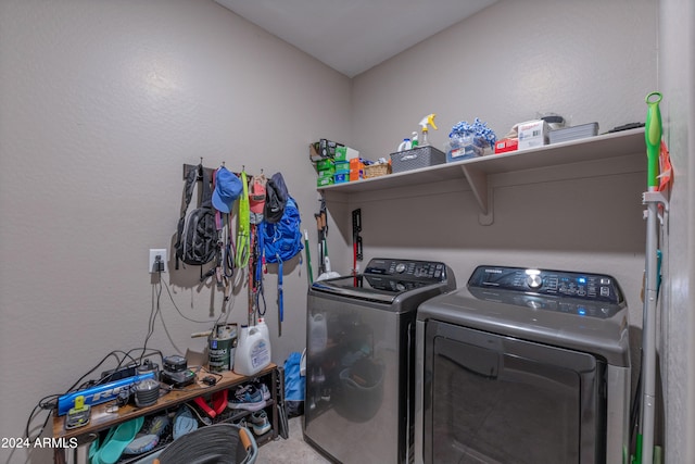 laundry room with washing machine and clothes dryer