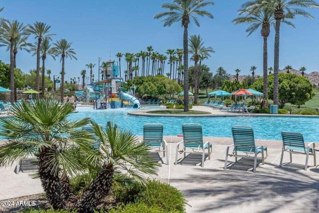 view of pool with a water slide