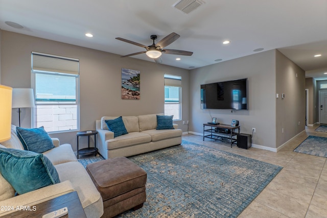 living room featuring ceiling fan and light tile patterned floors