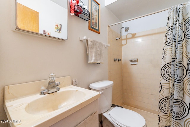 bathroom featuring a shower with curtain, vanity, and toilet