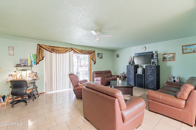 tiled living room featuring ceiling fan and a textured ceiling