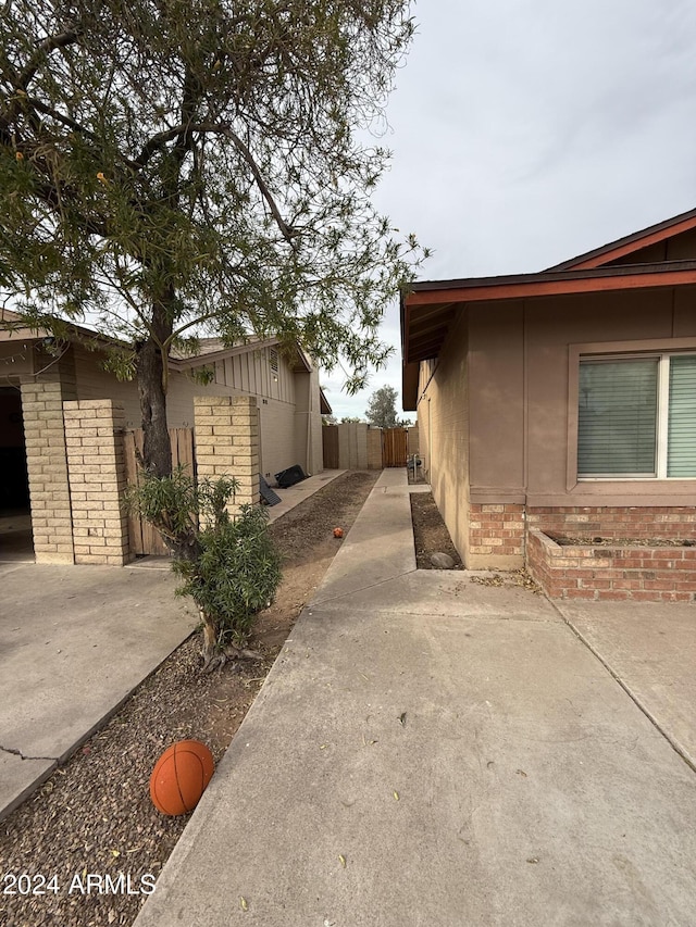 view of side of property featuring a patio