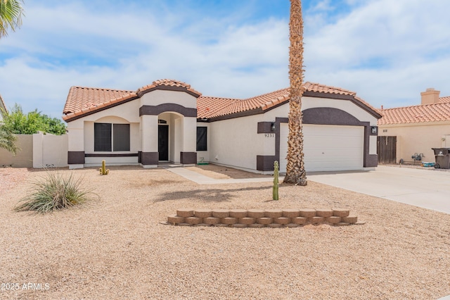 9231 W Grovers Ave, Peoria, AZ 85382 - mediterranean / spanish home featuring concrete driveway, stucco siding, a garage, and a tiled roof