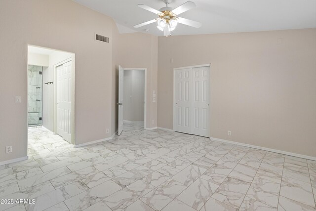9231 W Grovers Ave, Peoria, AZ 85382 - unfurnished bedroom featuring baseboards, light marble finish flooring, high vaulted ceiling, a ceiling fan, and a closet