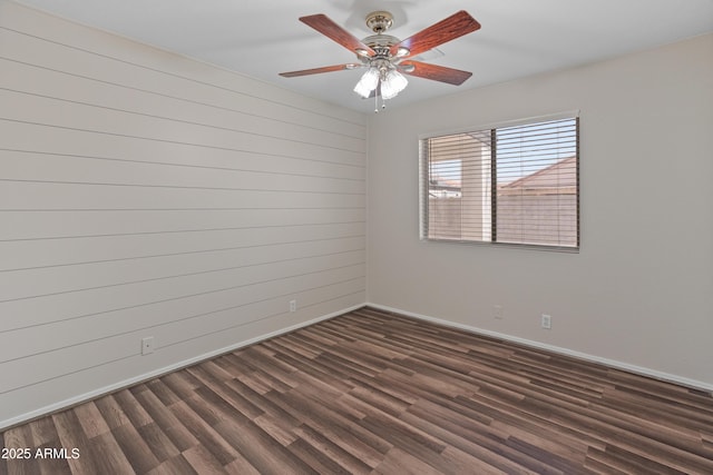 9231 W Grovers Ave, Peoria, AZ 85382 - spare room with baseboards, dark wood-type flooring, and ceiling fan