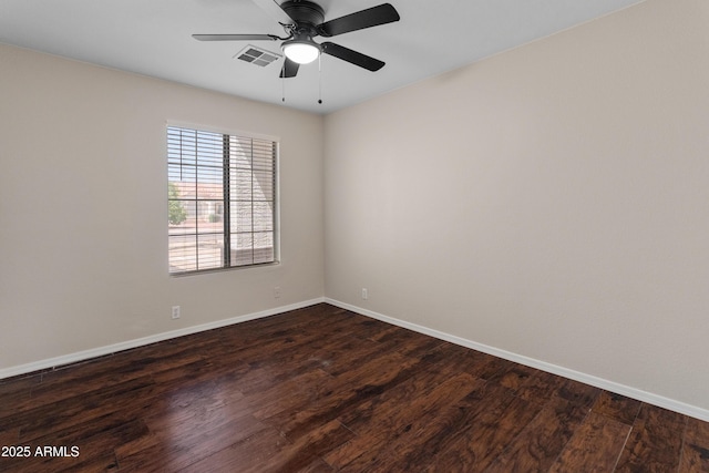9231 W Grovers Ave, Peoria, AZ 85382 - spare room with baseboards, dark wood-type flooring, and ceiling fan