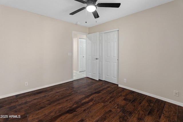 9231 W Grovers Ave, Peoria, AZ 85382 - unfurnished bedroom with dark wood finished floors, baseboards, a closet, and a ceiling fan