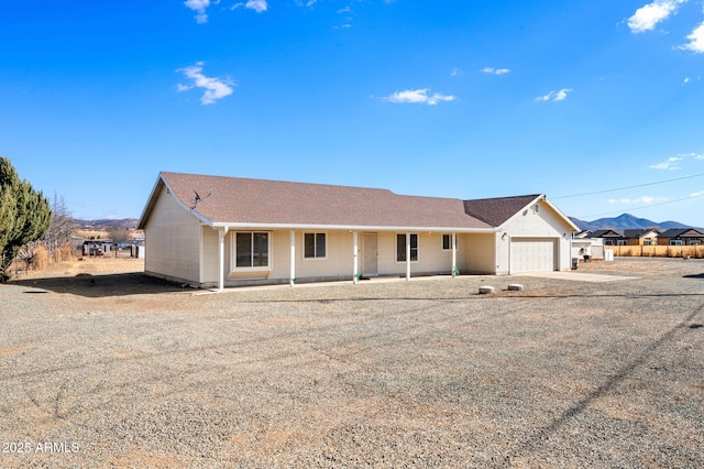 single story home with a garage