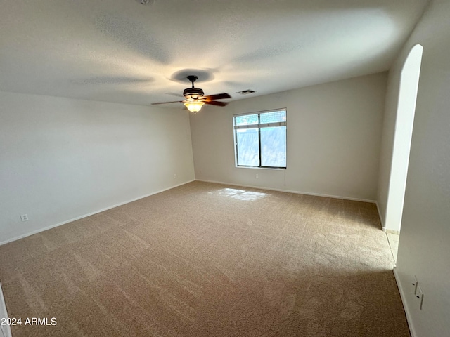 unfurnished room with carpet floors, a textured ceiling, and ceiling fan