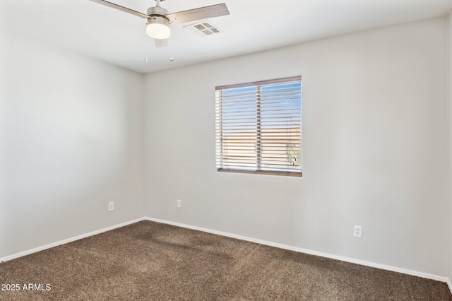 spare room with carpet floors, baseboards, and ceiling fan