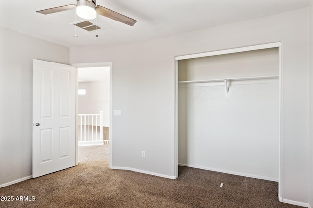 unfurnished bedroom featuring carpet, a closet, a ceiling fan, and baseboards