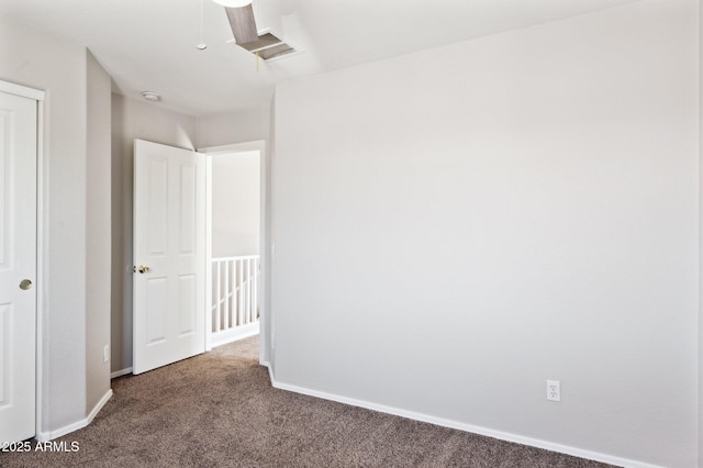 unfurnished bedroom with carpet and baseboards