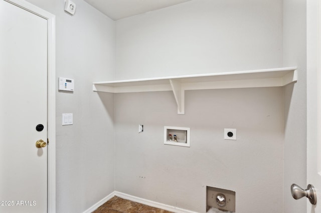 laundry area with hookup for an electric dryer, hookup for a washing machine, and baseboards
