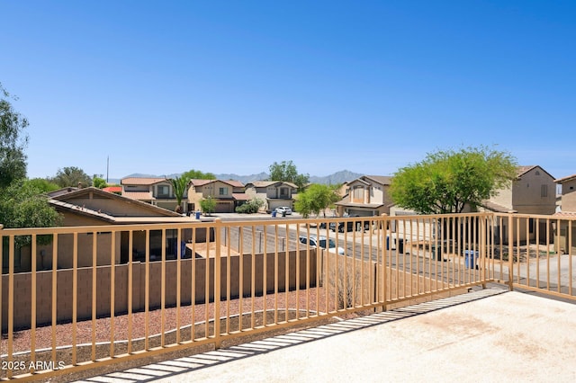 view of front of house featuring a residential view and a fenced backyard