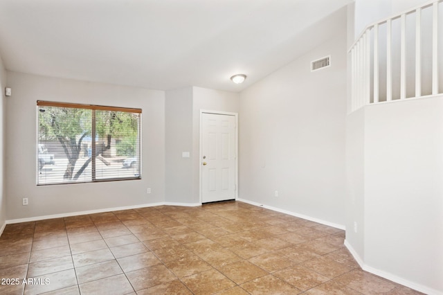 empty room featuring baseboards