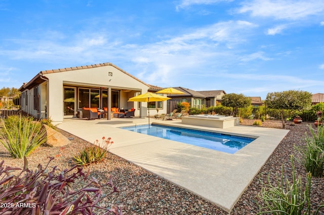 view of swimming pool featuring a hot tub, a patio, and outdoor lounge area