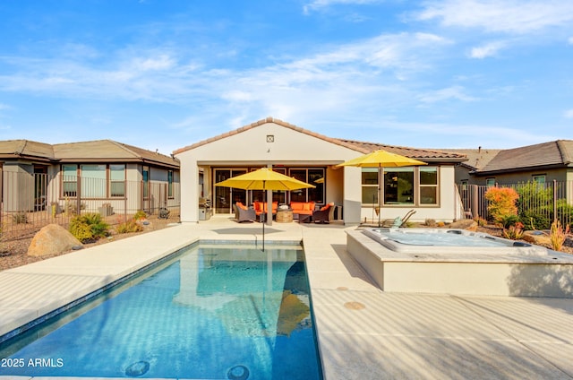 view of pool featuring an in ground hot tub and a patio