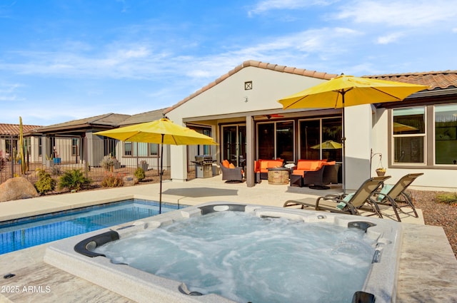 view of swimming pool with a grill, an outdoor hangout area, and a hot tub