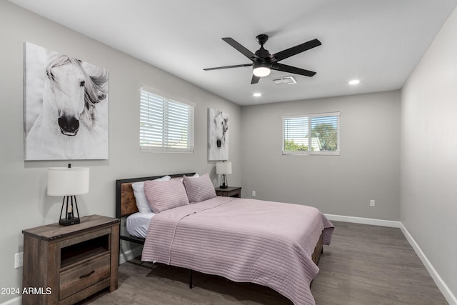 bedroom with hardwood / wood-style floors and ceiling fan