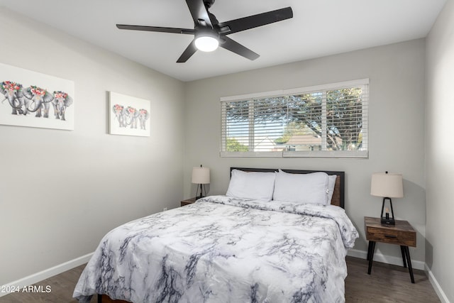 bedroom featuring ceiling fan and dark wood-type flooring