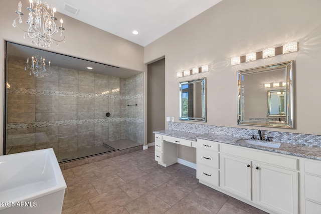 bathroom with vanity, tasteful backsplash, shower with separate bathtub, and an inviting chandelier