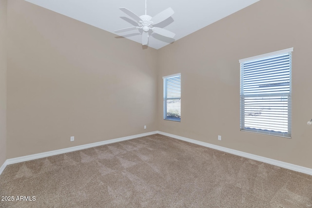 carpeted empty room with ceiling fan