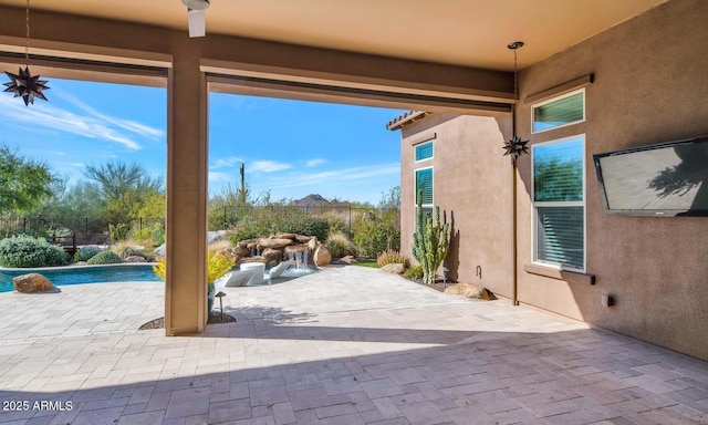 view of patio with a fenced in pool